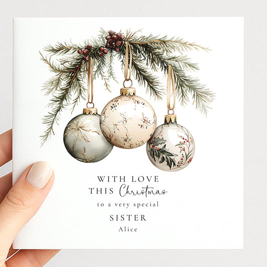 Personalised Christmas card for sister with elegant hanging bauble illustration and custom name, printed on 300gsm card
