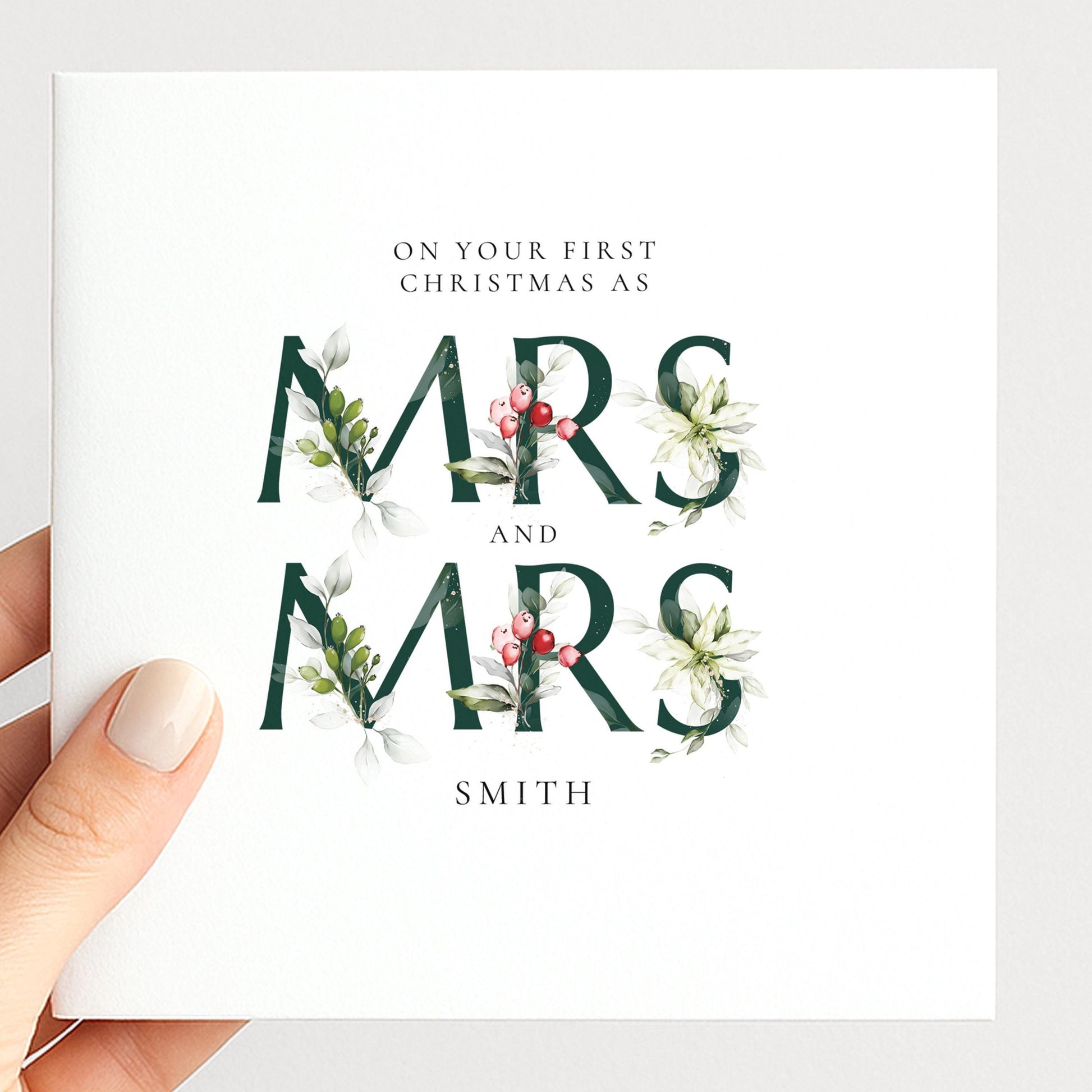 Personalised first Christmas card for Mrs and Mrs with elegant floral typography and surname, printed on 300gsm card