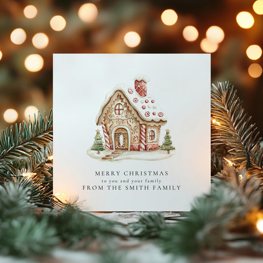 Personalised from our family Christmas card with gingerbread house illustration and family name, printed on 300gsm card