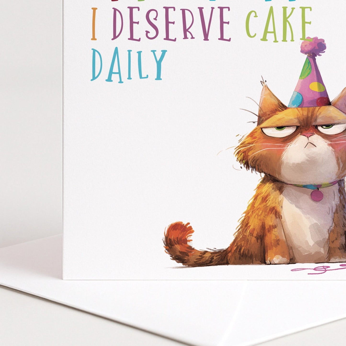 Funny Cat Birthday Card by Whimsi Lilley featuring a humorous illustration and the message "At this point I deserve cake daily."