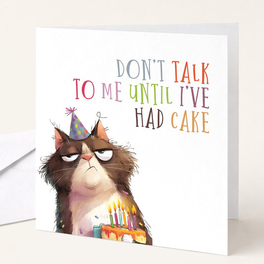 Funny Cat Birthday Card by Whimsi Lilley featuring a humorous illustration and the message "Don't Talk To Me Until I've Had Cake."