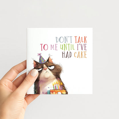 Funny Cat Birthday Card by Whimsi Lilley featuring a humorous design and the message "Don't Talk To Me Until I've Had Cake."