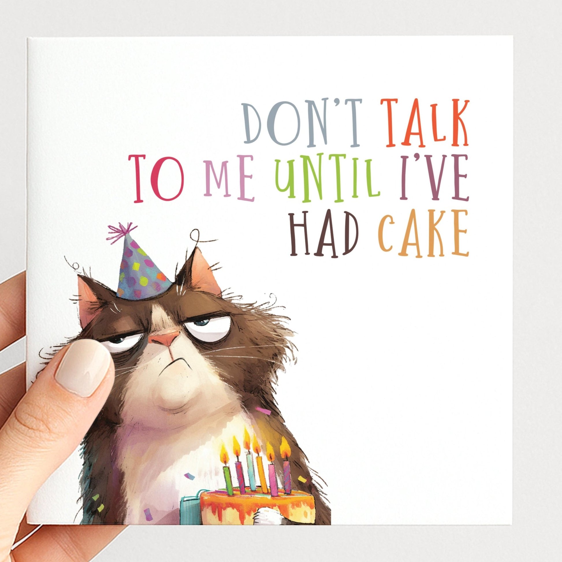 Funny cat birthday card by Whimsi Lilley featuring a humorous design and the message "Don't Talk To Me Until I've Had Cake."
