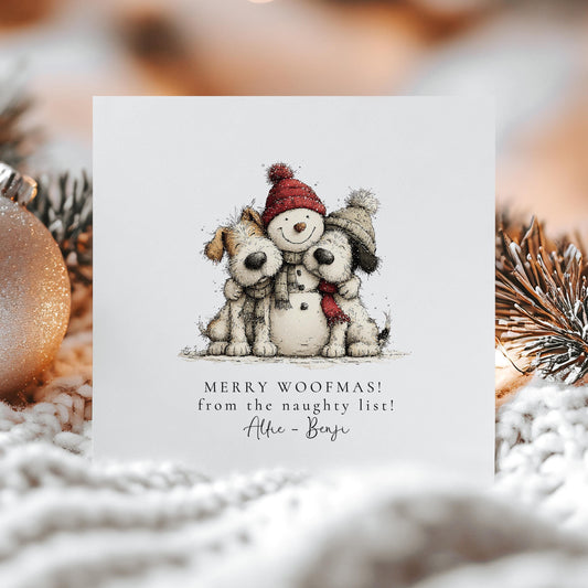 Funny personalised dog Christmas card with two dogs and a snowman, captioned Merry Woofmas naughty list