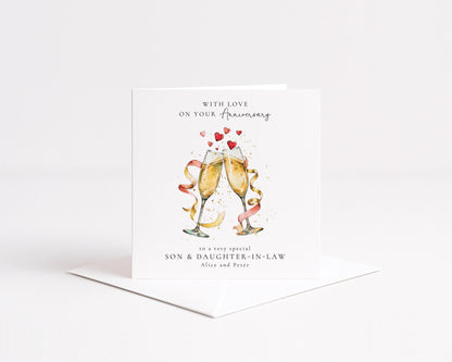 The image is a greeting card with a celebratory design featuring champagne glasses and hearts.