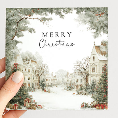 A charming snowy village Christmas card, personalised with names, printed on 300gsm card