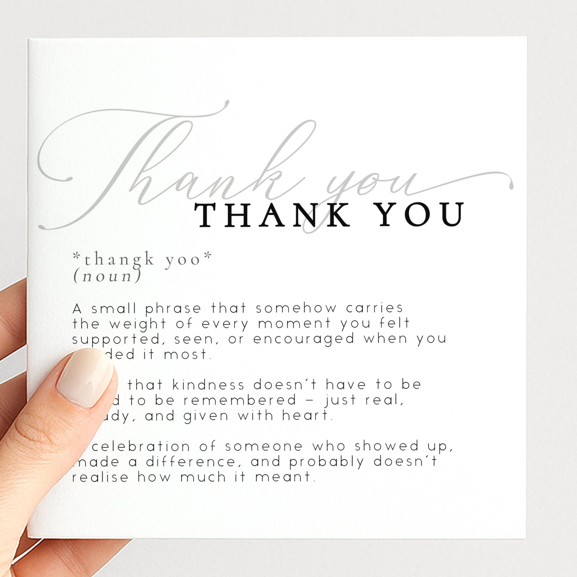 a hand holding a card with a definition of "Thank You" written on it.