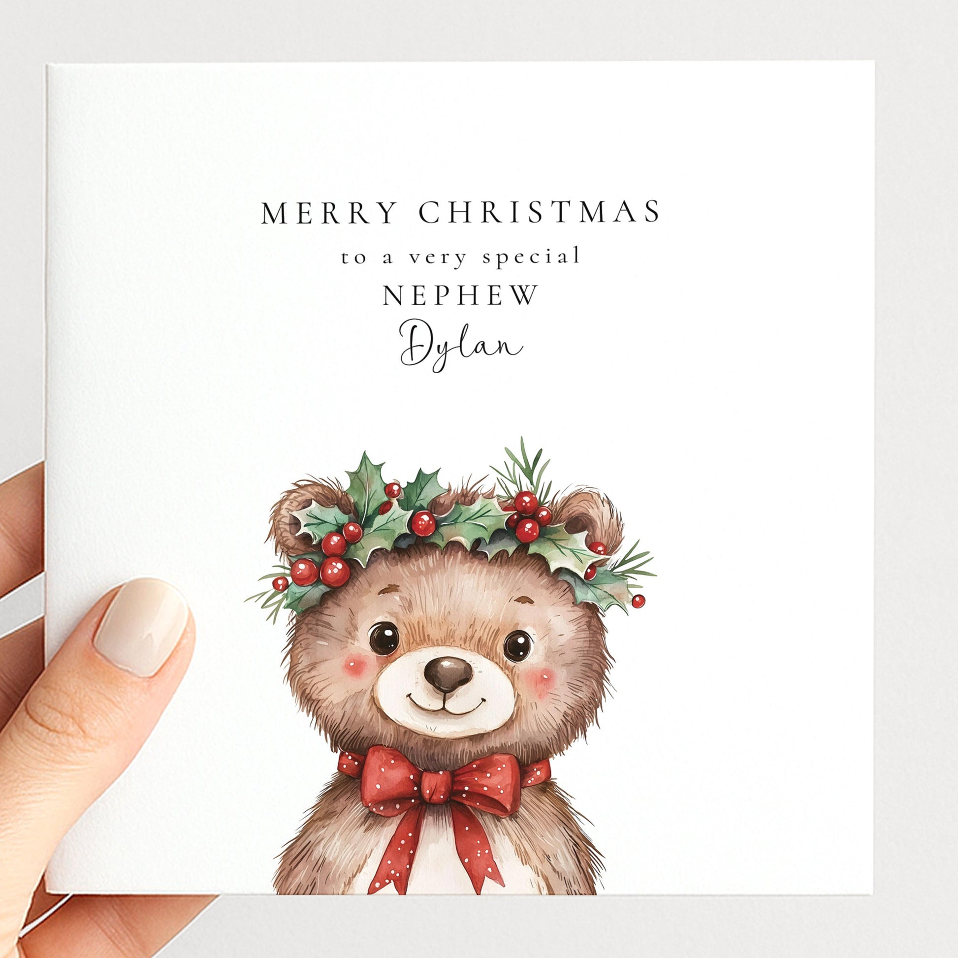 Cute holly crown bear Christmas card for a special nephew, personalised with his name, printed on 300gsm card