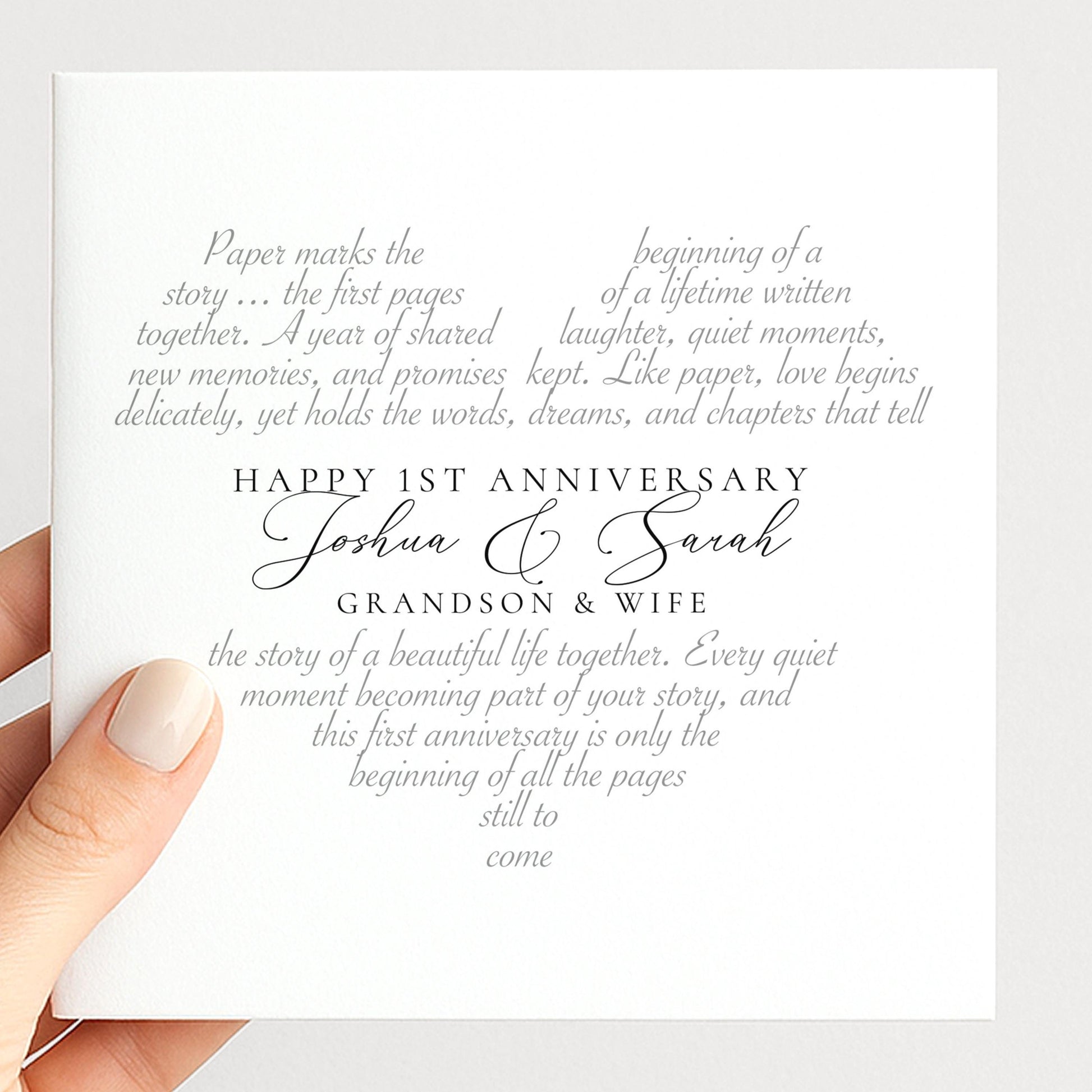 The image is a hand holding a card with text on it. The text appears to be a message celebrating the first anniversary of Joshua and Sarah, their grandfather and wife.