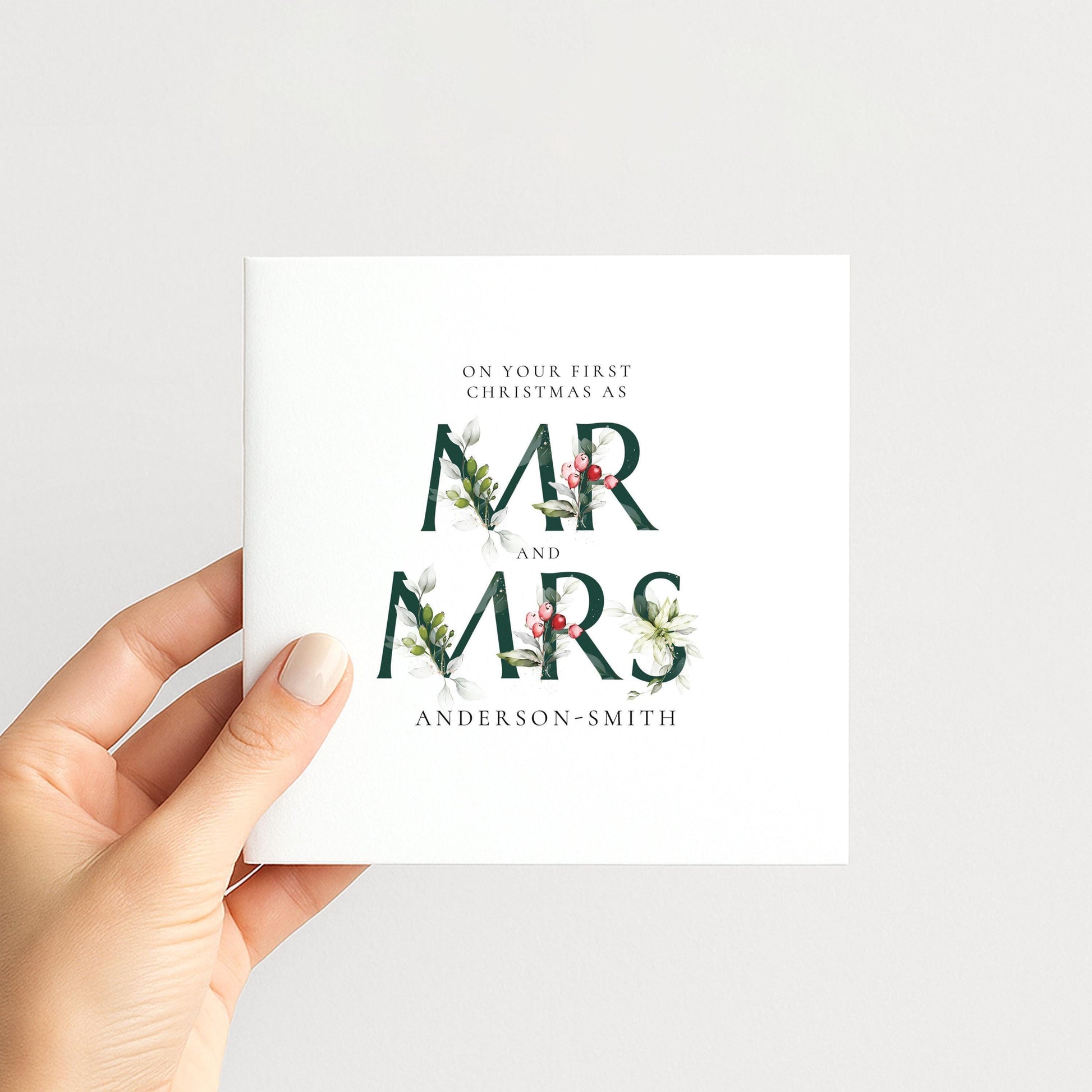 Personalised first Christmas card for Mr and Mrs with elegant floral typography and surname, printed on 300gsm card