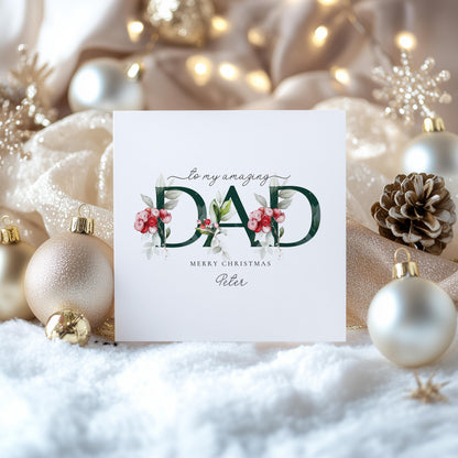Personalised Christmas card for Dad with festive floral DAD letter typography and custom name, printed on 300gsm card