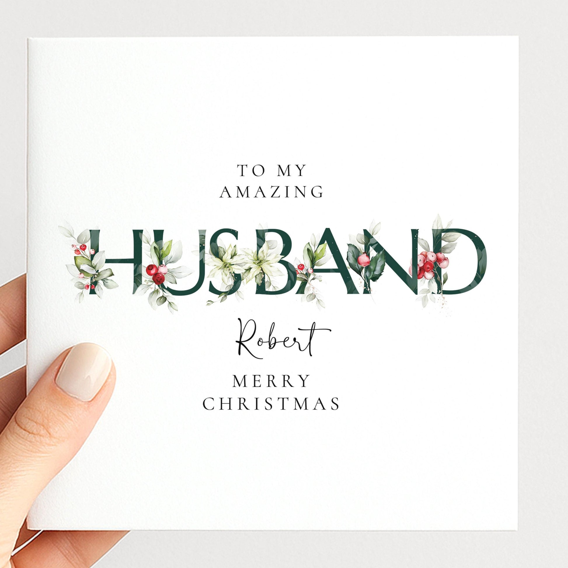 Personalised Christmas card for husband with festive floral HUSBAND letter typography and custom name, printed on 300gsm card
