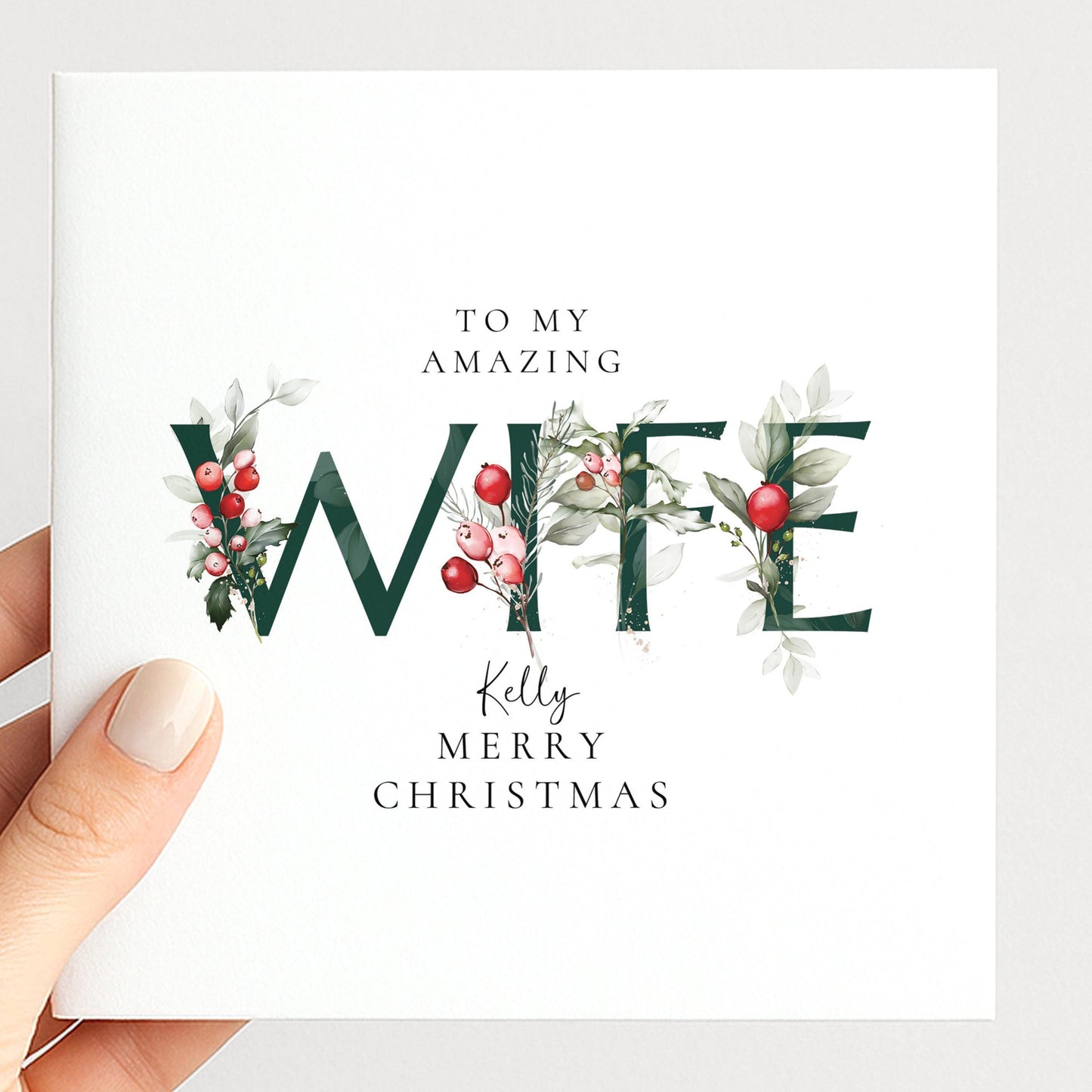 Personalised Christmas card for wife with festive floral WIFE letter typography and custom name, printed on 300gsm card